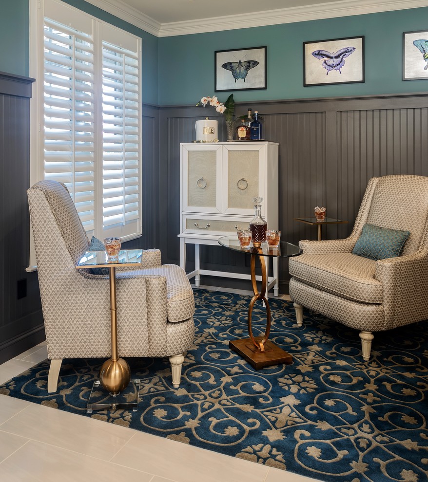 Small transitional open concept family room in Other with a home bar, blue walls, marble floors and white floor.