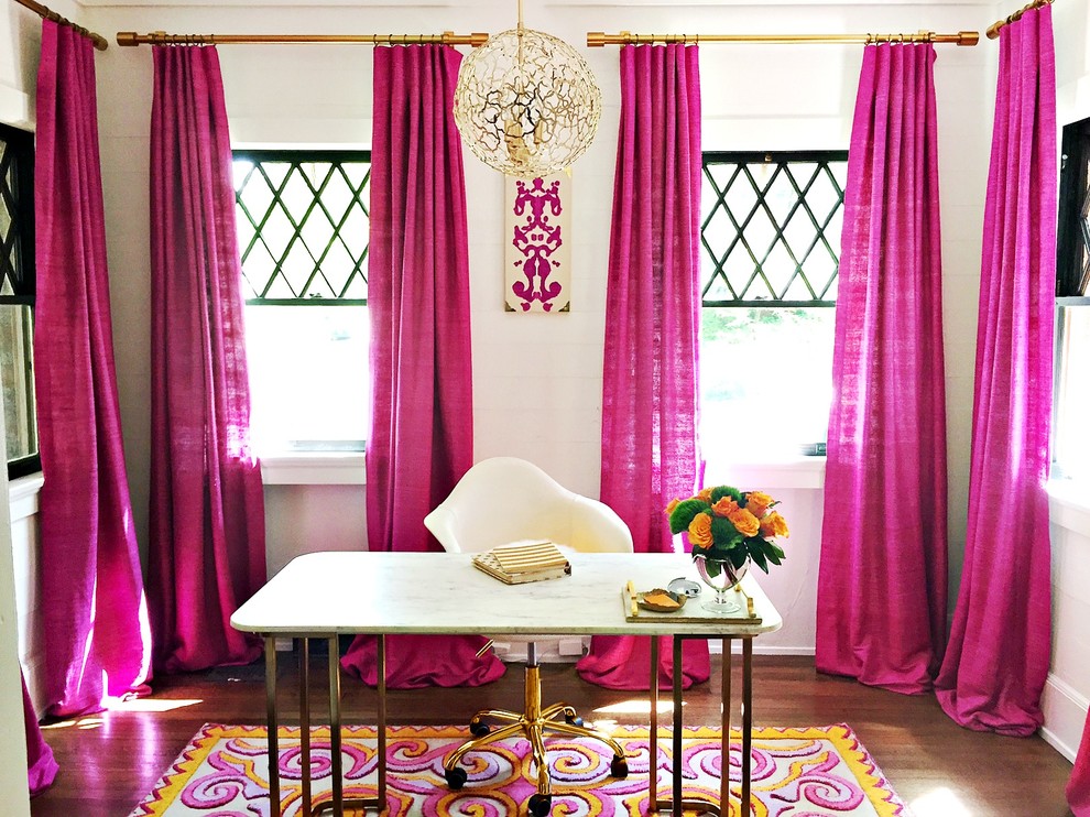 Example of a small minimalist freestanding desk medium tone wood floor home office design in Atlanta with white walls