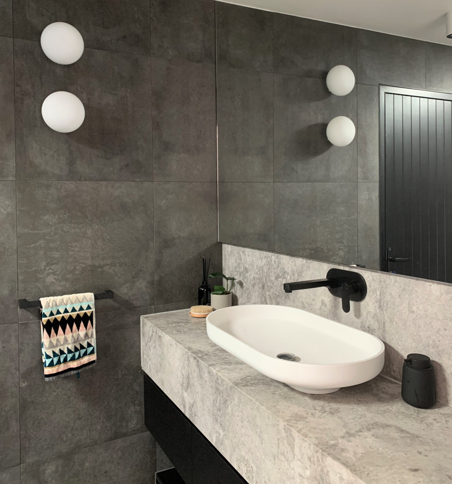 Contemporary bathroom in Melbourne with white cabinets, gray tile, porcelain tile, marble benchtops, an open shower, grey benchtops, a single vanity, a floating vanity, an open shower and porcelain floors.