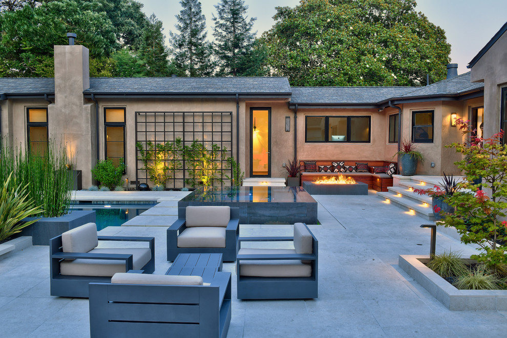 Inspiration for a large contemporary backyard patio in San Francisco with a fire feature, no cover and tile.