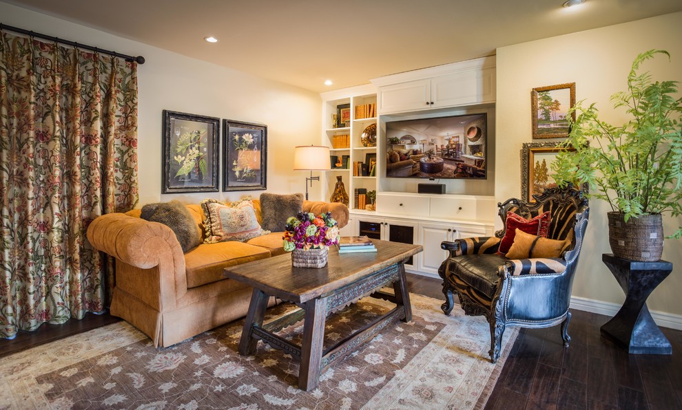 Inspiration for an eclectic living room in Phoenix with dark hardwood floors and a wall-mounted tv.