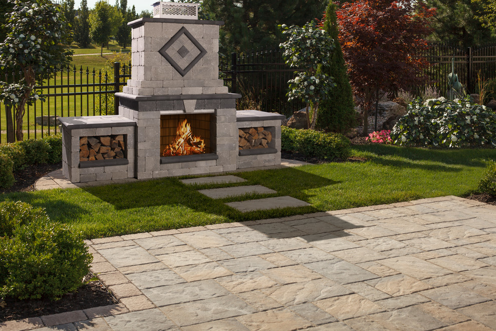 Mid-sized mountain style backyard patio photo with a fire pit