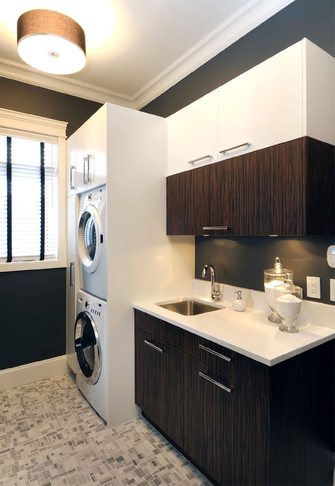 This is an example of a contemporary laundry room in Other with grey floor.