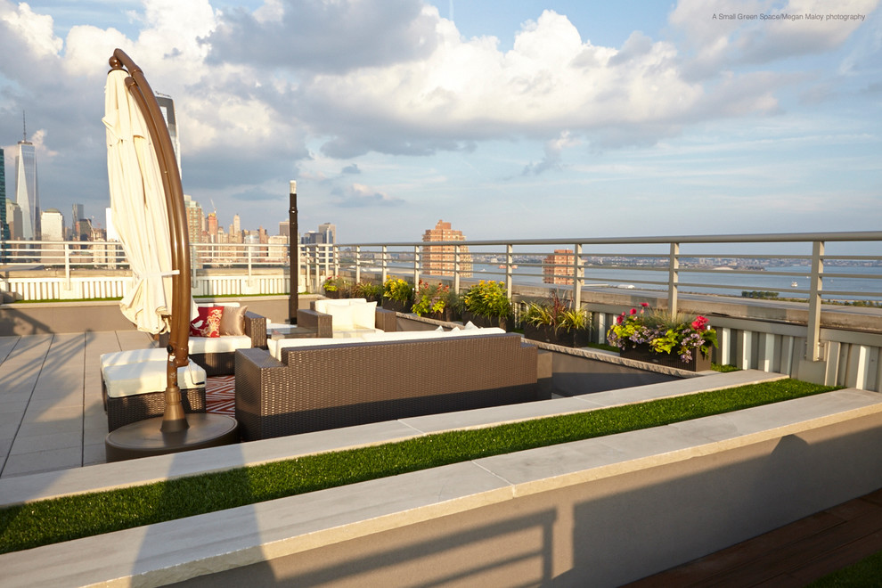 Large contemporary rooftop deck in New York with no cover.