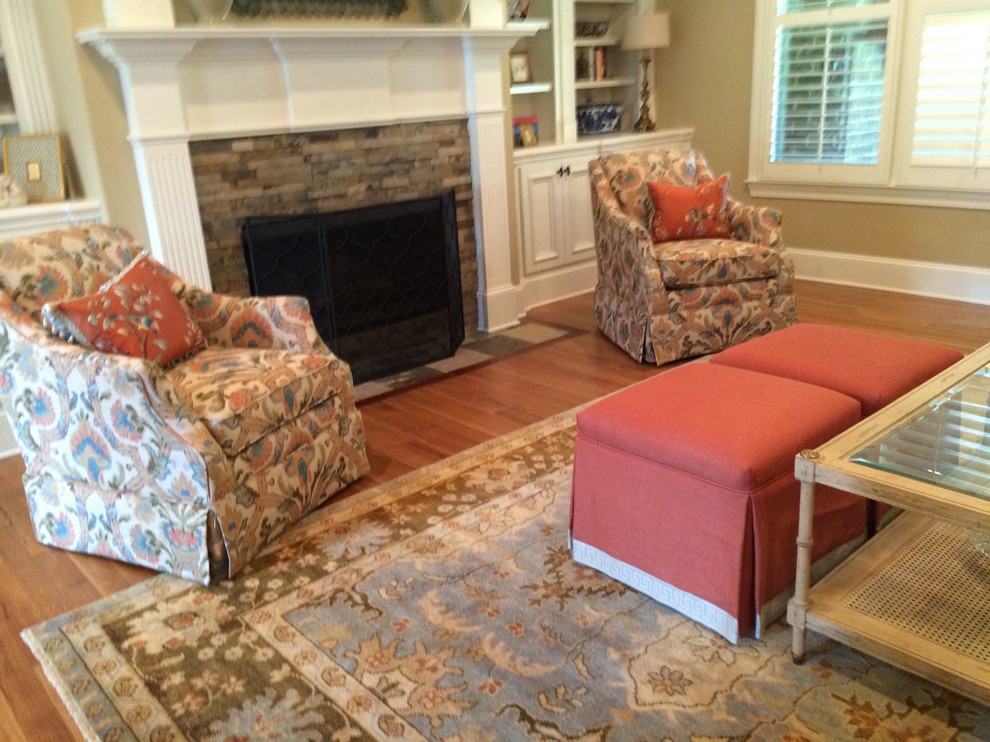Living room - mid-sized transitional formal and open concept living room idea with a standard fireplace and a stone fireplace