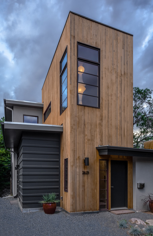 Inspiration for a contemporary exterior in Denver with mixed siding.