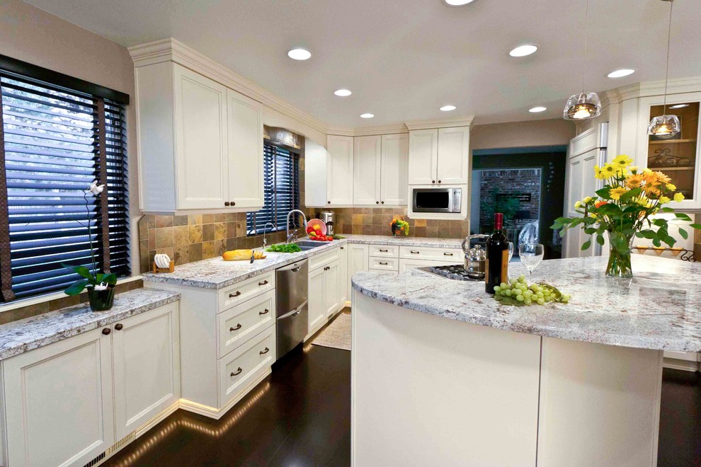 Eat-in kitchen - large transitional galley dark wood floor eat-in kitchen idea in Seattle with an undermount sink, white cabinets, granite countertops, stainless steel appliances and an island