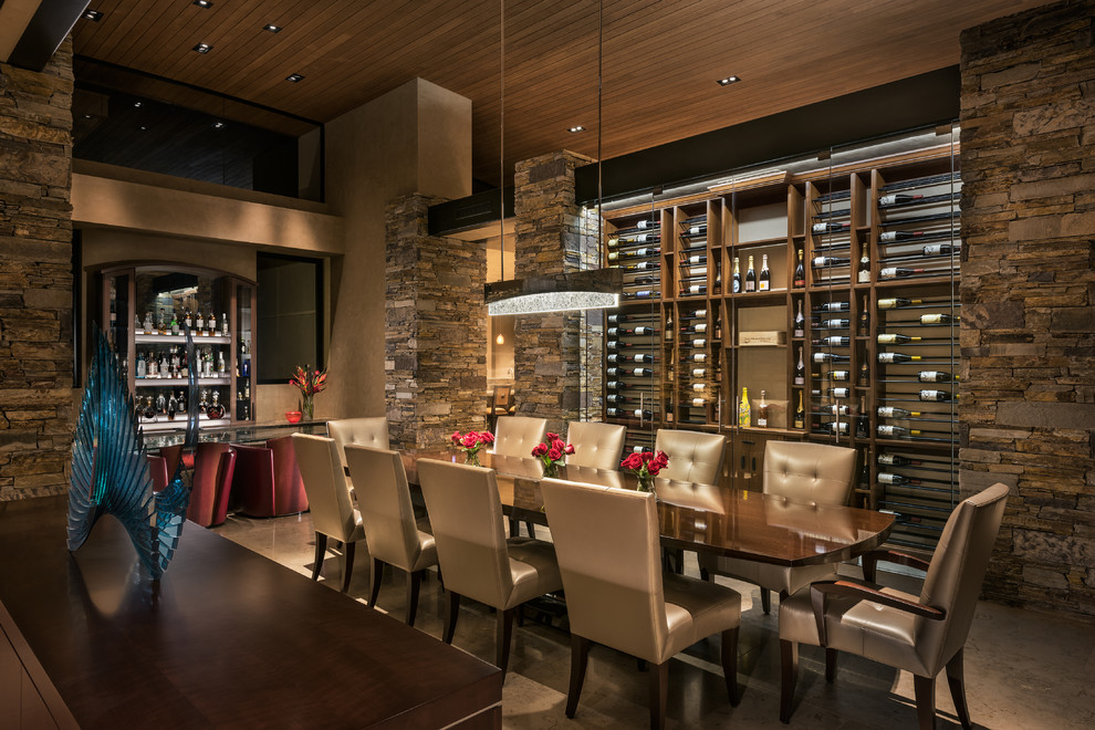 Expansive contemporary open plan dining in Phoenix with beige walls, limestone floors and no fireplace.