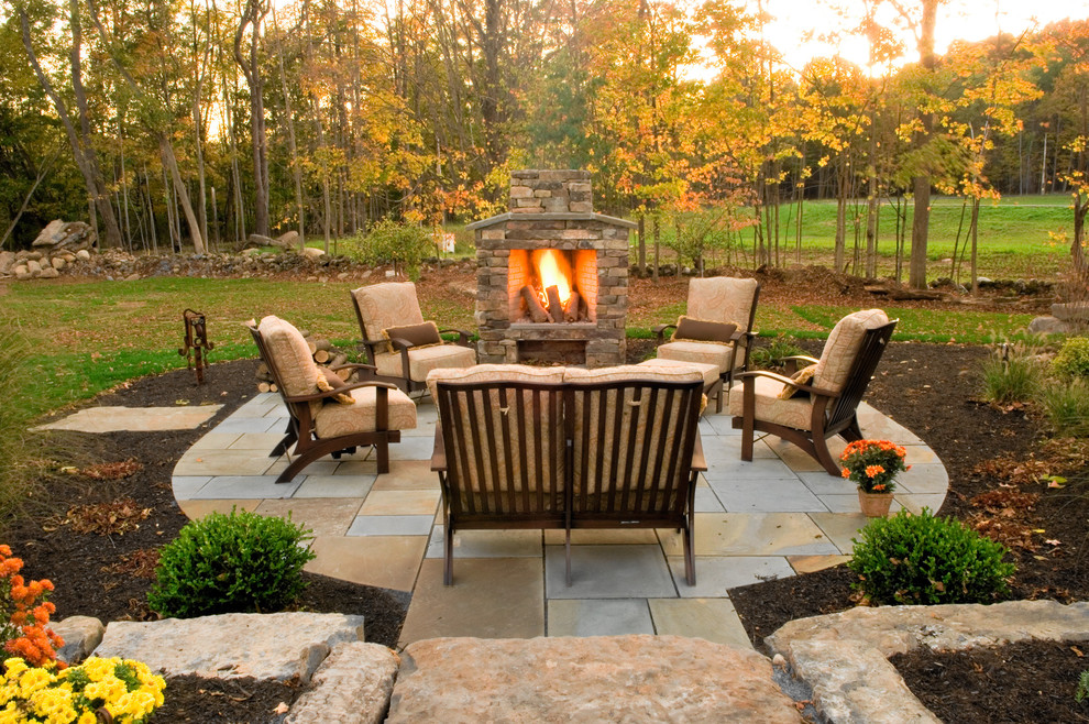 Design ideas for a traditional patio in Boston with a fire feature.