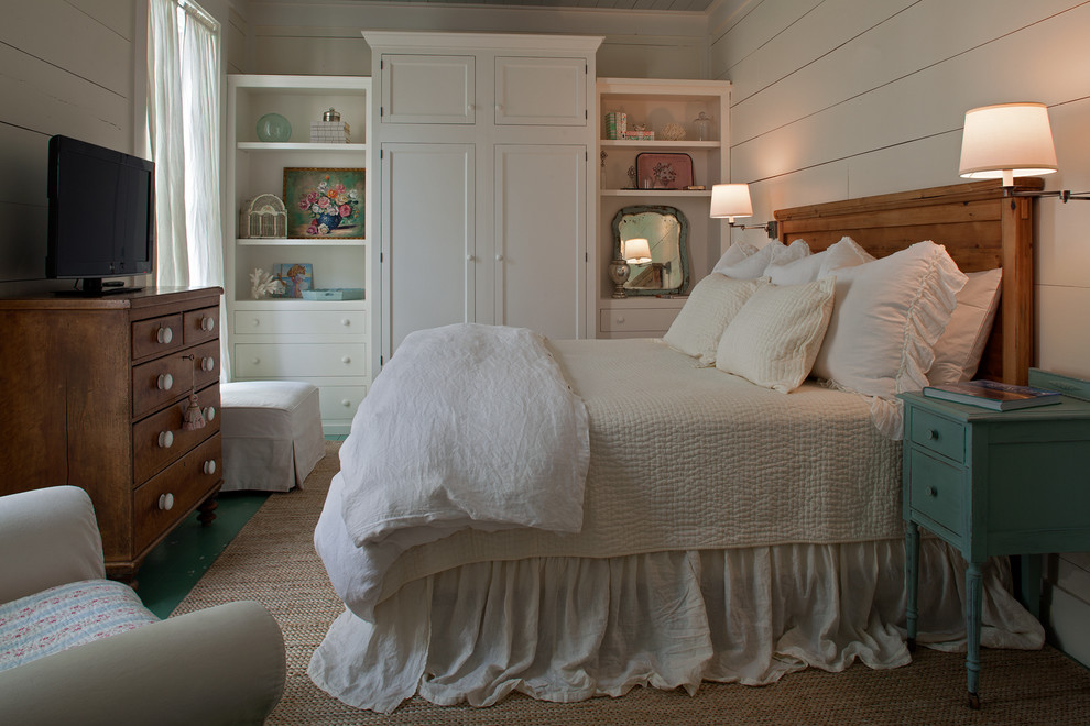 Inspiration for a beach style bedroom in Miami with beige walls.