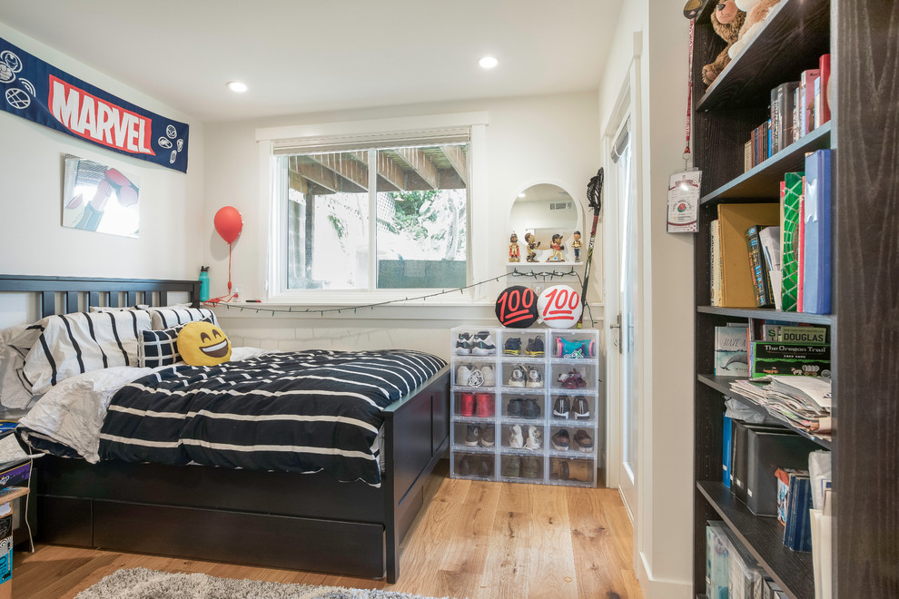 Mid-sized transitional kids' room in San Francisco with white walls, medium hardwood floors and brown floor for boys.