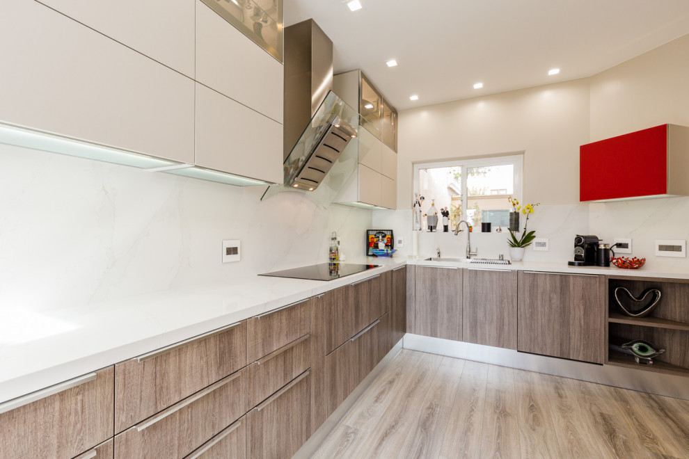 Inspiration for a mid-sized modern l-shaped separate kitchen in San Francisco with a drop-in sink, flat-panel cabinets, brown cabinets, quartz benchtops, white splashback, stainless steel appliances, laminate floors, no island, grey floor and white benchtop.