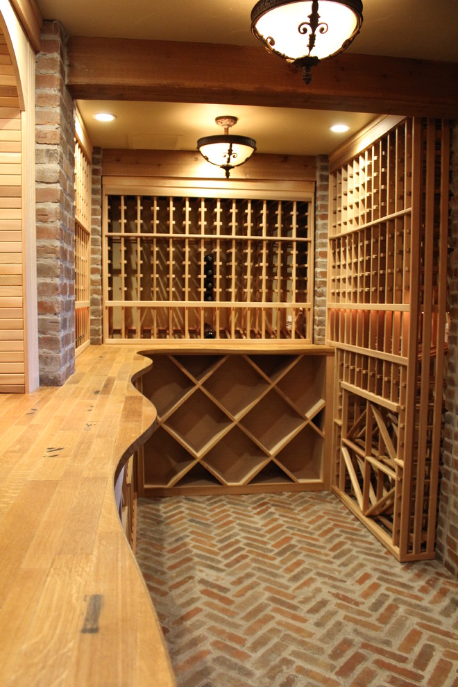 Inspiration for a huge rustic red floor wine cellar remodel in Boston