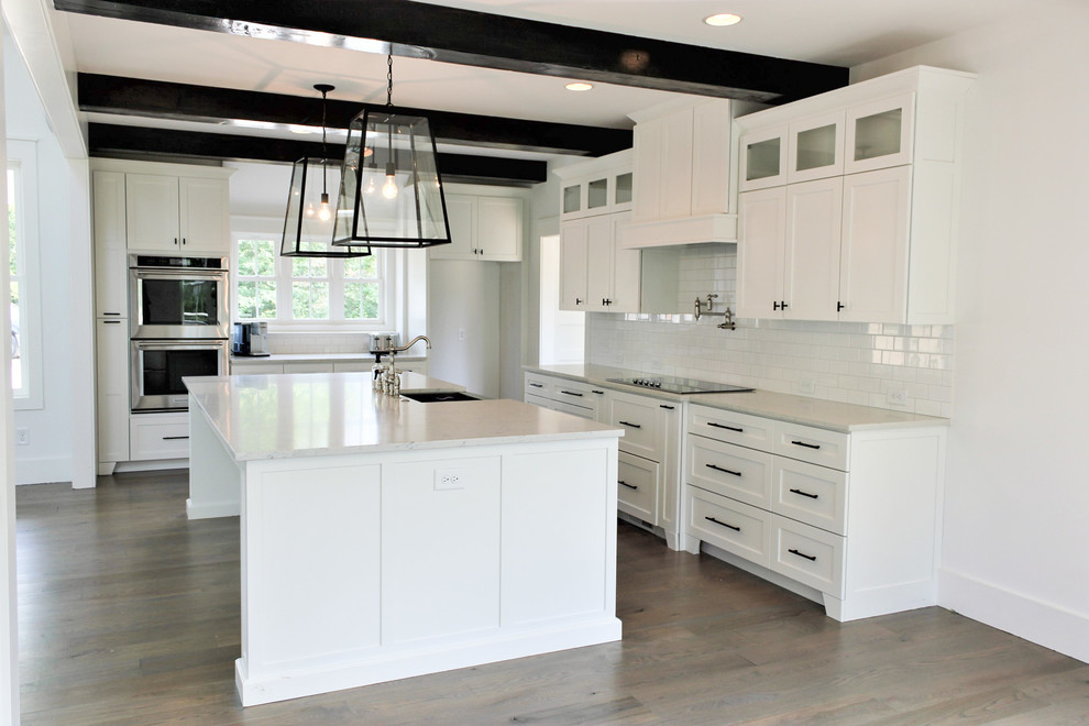 Mid-sized country eat-in kitchen in Other with recessed-panel cabinets, white cabinets, marble benchtops and with island.
