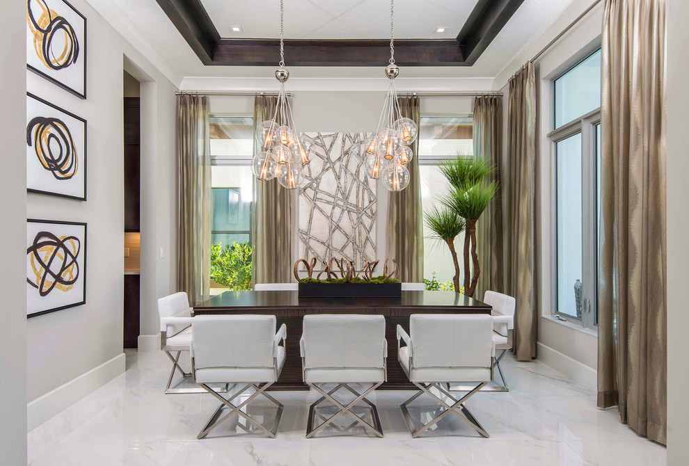Photo of a contemporary separate dining room in Miami with grey walls, ceramic floors, white floor and coffered.