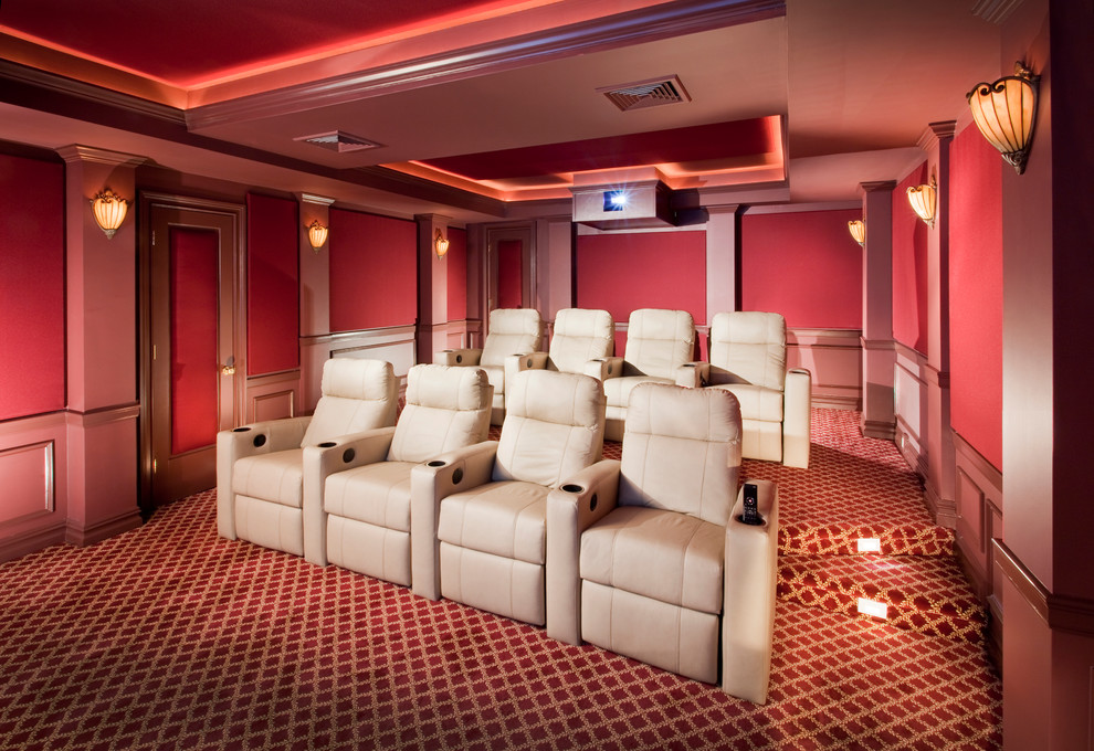 Mid-sized mediterranean enclosed home theatre in New York with red walls, carpet and a projector screen.