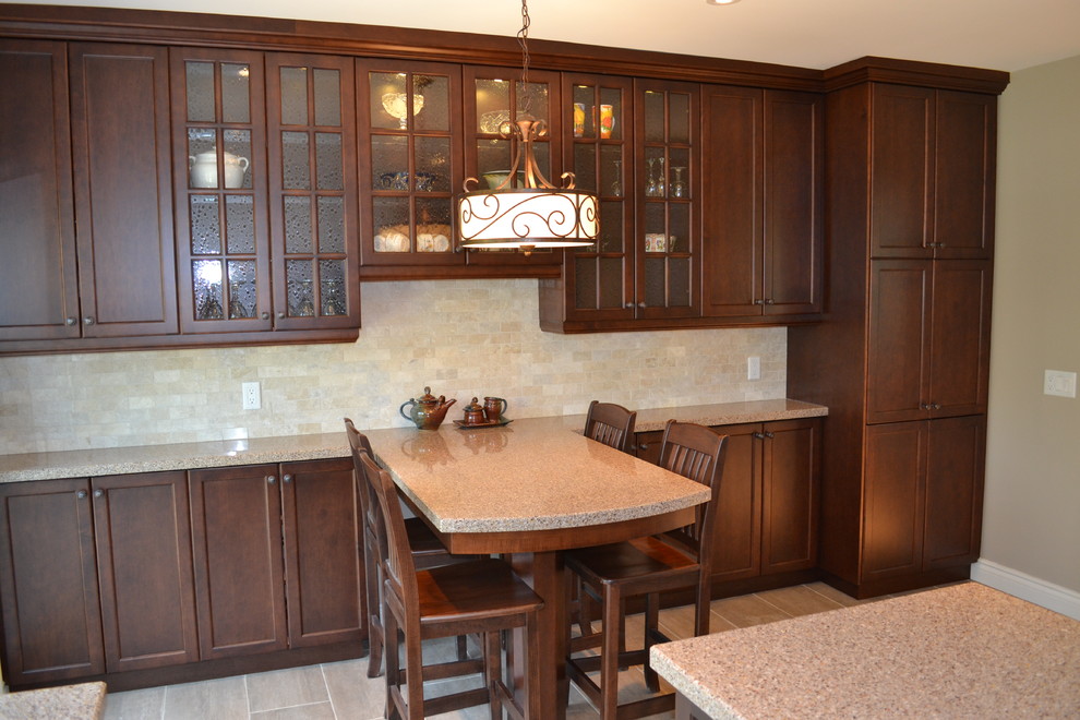 Inspiration for a mid-sized transitional eat-in kitchen remodel in Toronto with flat-panel cabinets, medium tone wood cabinets and two islands