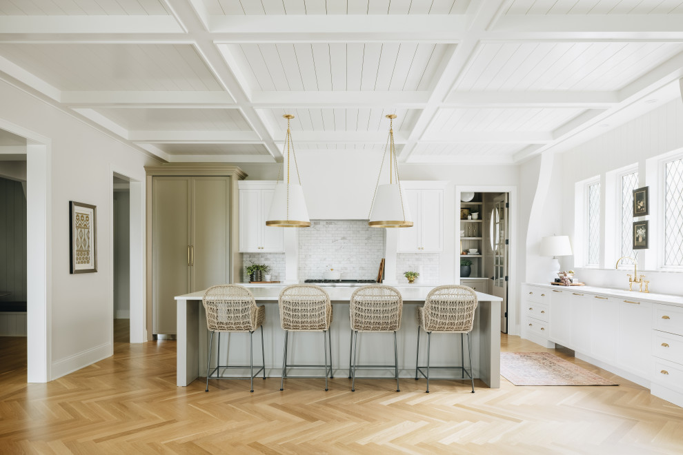 Inspiration for a traditional l-shaped kitchen in Chicago with recessed-panel cabinets, white cabinets, medium hardwood flooring, an island, brown floors, white worktops and a coffered ceiling.