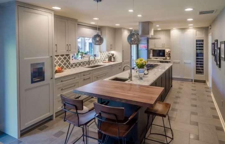 Enclosed kitchen - large transitional l-shaped cement tile floor and beige floor enclosed kitchen idea in Denver with an undermount sink, recessed-panel cabinets, gray cabinets, marble countertops, multicolored backsplash, paneled appliances, an island and gray countertops