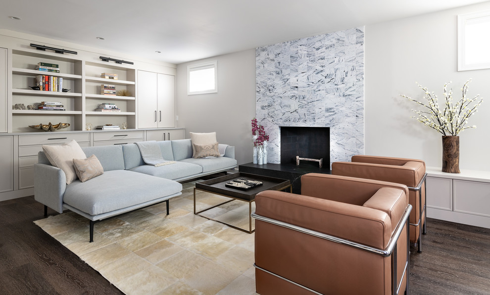 Inspiration for a mid-sized contemporary look-out basement in DC Metro with white walls, dark hardwood floors, a standard fireplace, a brick fireplace surround and brown floor.