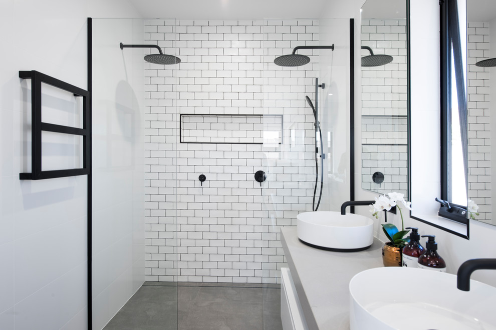 Large contemporary bathroom in Newcastle - Maitland with flat-panel cabinets, white cabinets, white tile, subway tile, white walls, concrete floors, a vessel sink, concrete benchtops, grey floor, an open shower, grey benchtops and a double shower.