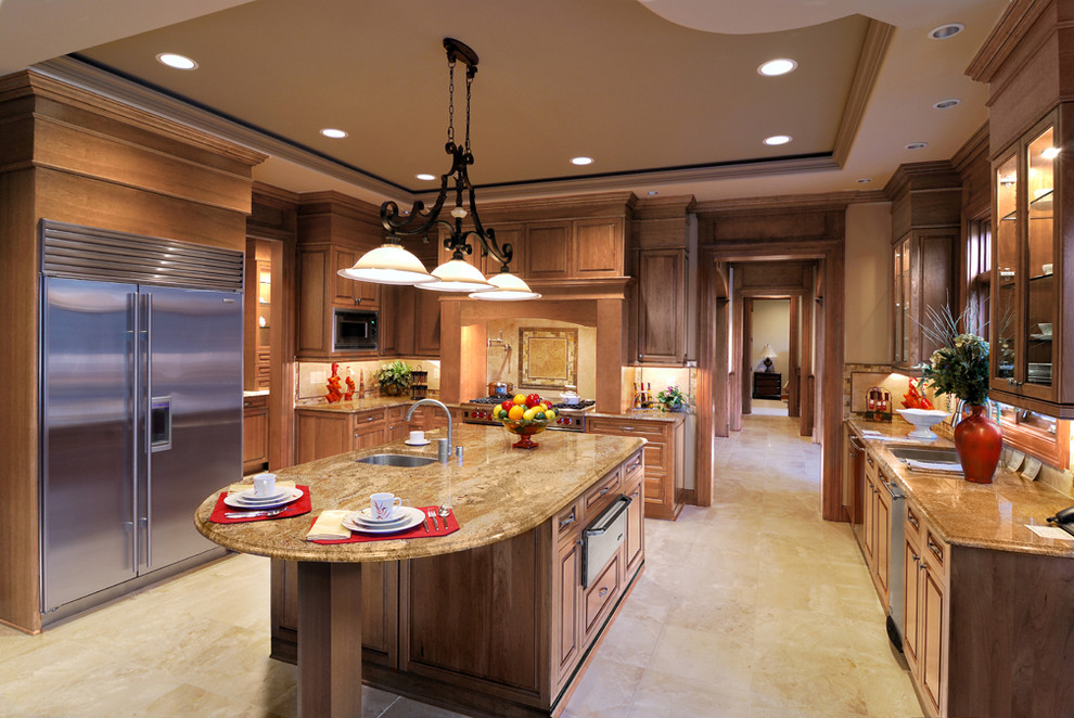 Photo of a traditional u-shaped kitchen in Minneapolis with an undermount sink, raised-panel cabinets, medium wood cabinets, beige splashback and stainless steel appliances.