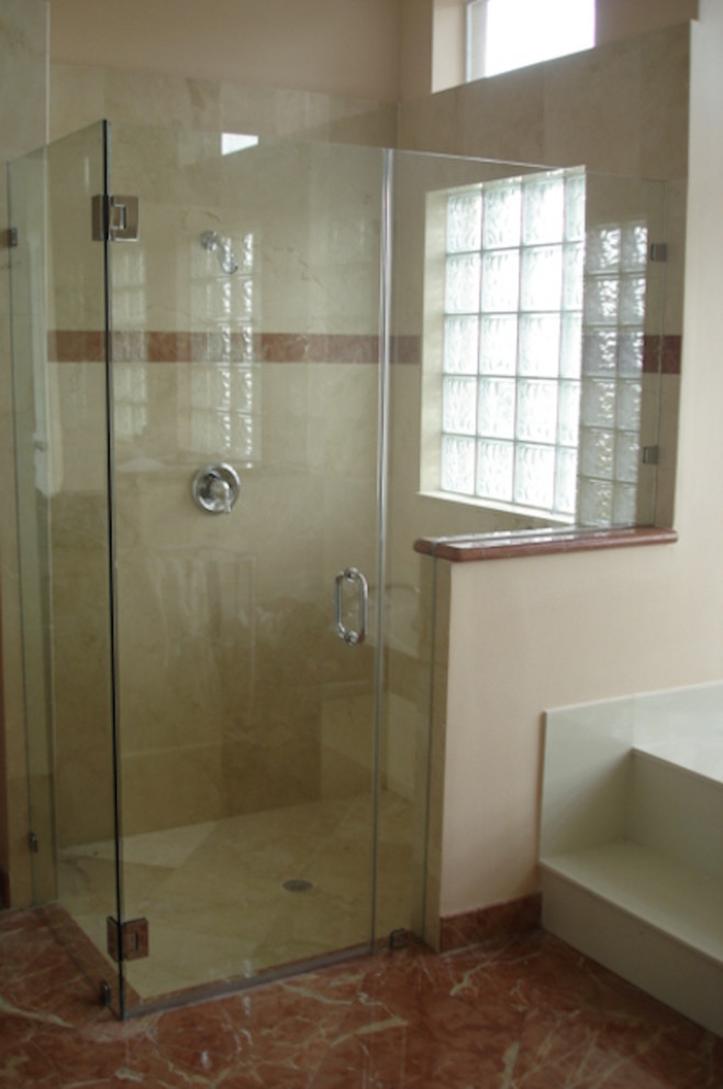 Design ideas for a mid-sized traditional 3/4 bathroom in Atlanta with a corner shower, beige tile, ceramic tile, beige walls, marble floors, orange floor and a hinged shower door.