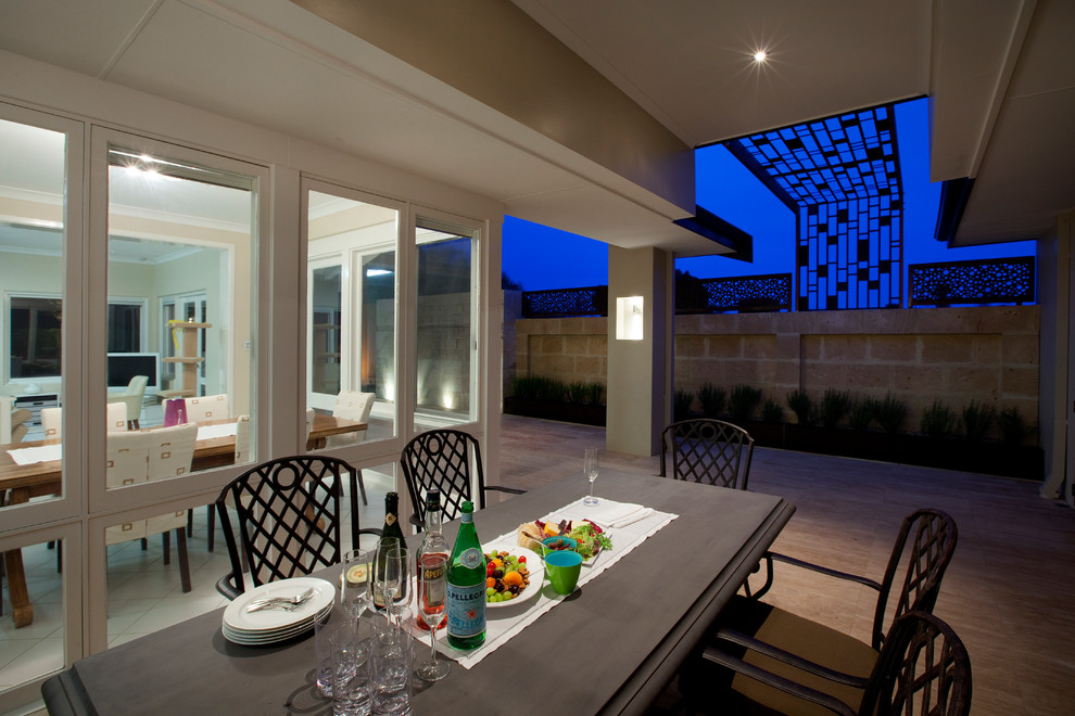 Design ideas for a large contemporary backyard garden in Perth with a water feature and natural stone pavers.