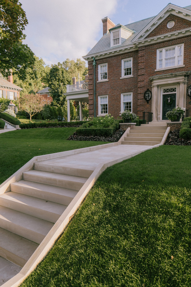 Large traditional front yard formal garden in Toronto with with path.