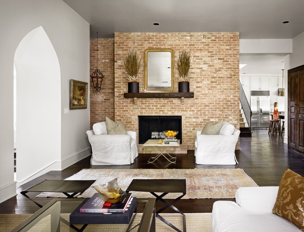 Traditional living room in Austin with a brick fireplace surround.