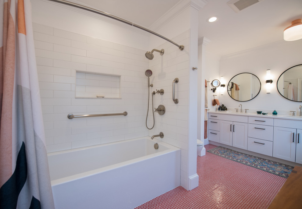 Inspiration for a medium sized bohemian ensuite bathroom in Bridgeport with white cabinets, an alcove bath, a shower/bath combination, a two-piece toilet, ceramic flooring, a submerged sink, solid surface worktops, red floors, a shower curtain, white worktops, a wall niche, double sinks and a built in vanity unit.