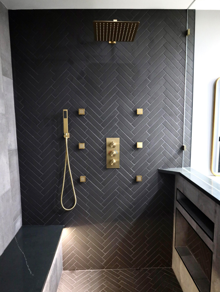Photo of a large modern ensuite wet room bathroom in Tampa with shaker cabinets, black cabinets, black tiles, metro tiles, grey walls, ceramic flooring, a submerged sink, marble worktops, an open shower, a shower bench and double sinks.