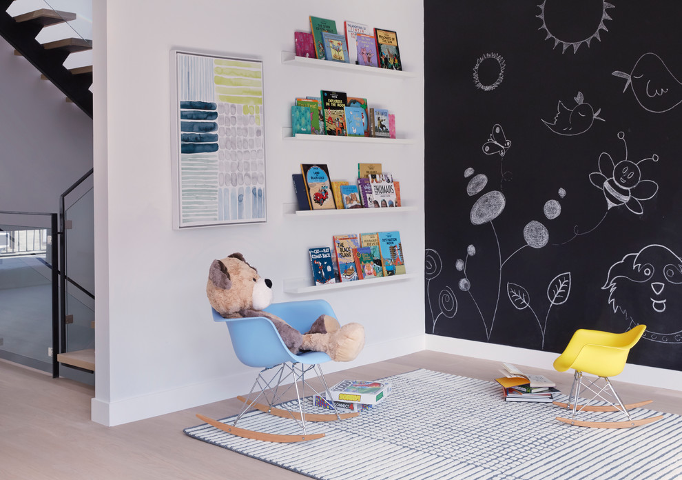 Mid-sized contemporary gender-neutral kids' playroom in Other with white walls, light hardwood floors and beige floor for kids 4-10 years old.