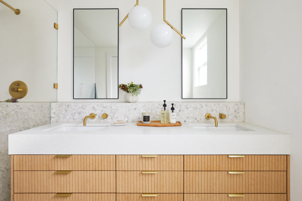 Small midcentury master bathroom in San Francisco with brown cabinets, a freestanding tub, a shower/bathtub combo, a wall-mount toilet, white tile, ceramic tile, white walls, terrazzo floors, an undermount sink, engineered quartz benchtops, white floor, an open shower, white benchtops and a double vanity.