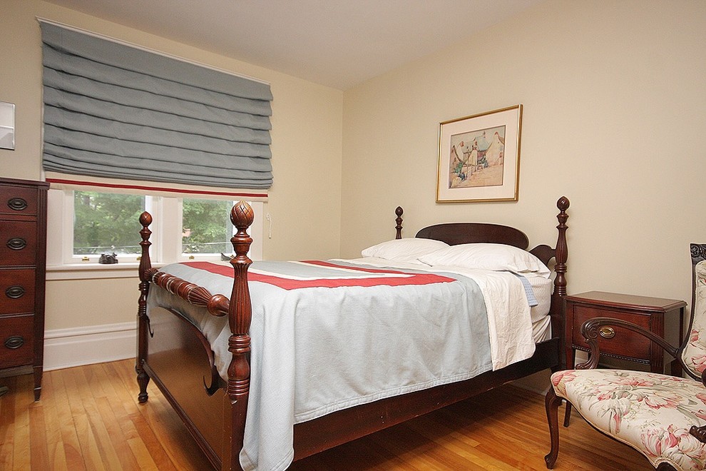 This is an example of a transitional bedroom in Toronto.