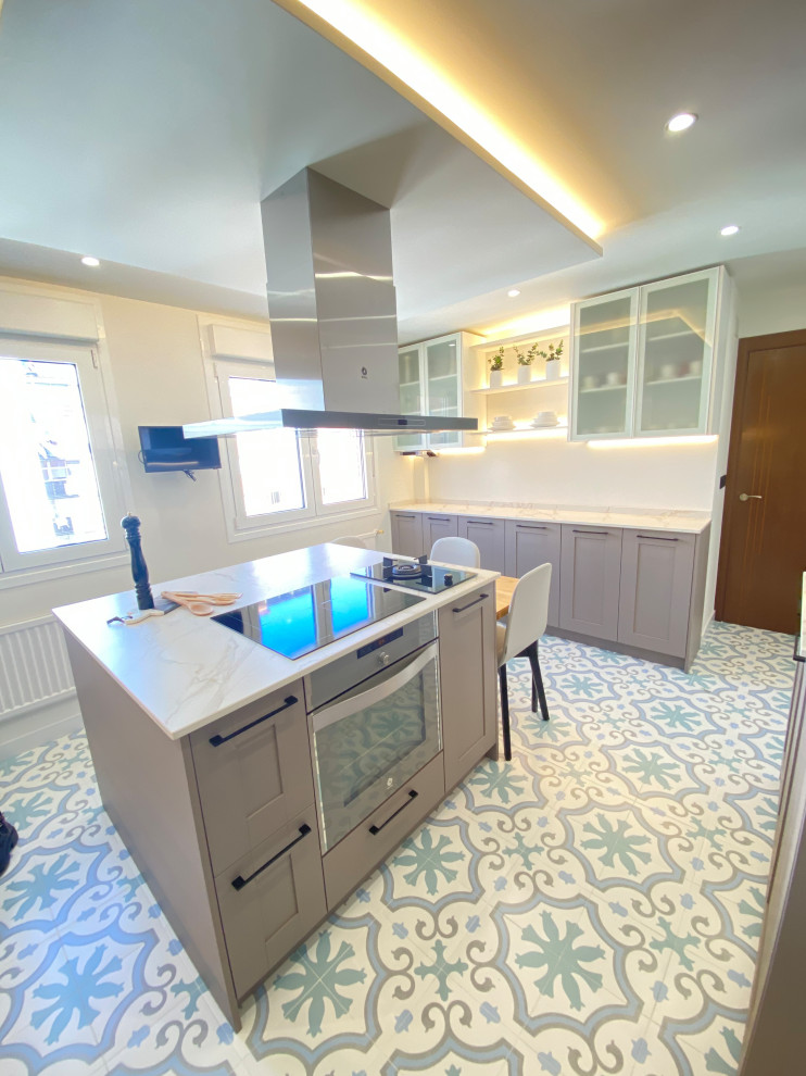 Large transitional u-shaped separate kitchen in Other with an undermount sink, beaded inset cabinets, pink cabinets, marble benchtops, white splashback, marble splashback, coloured appliances, porcelain floors, multiple islands, multi-coloured floor and white benchtop.