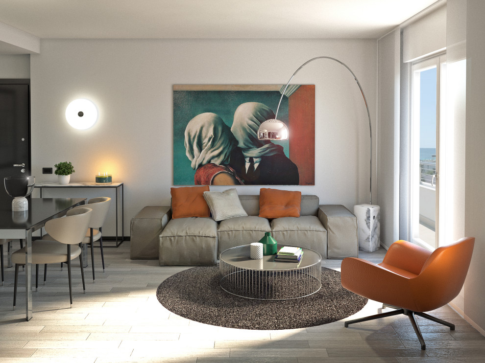 Photo of a mid-sized modern open concept living room in Milan with green walls, laminate floors, a wall-mounted tv and grey floor.