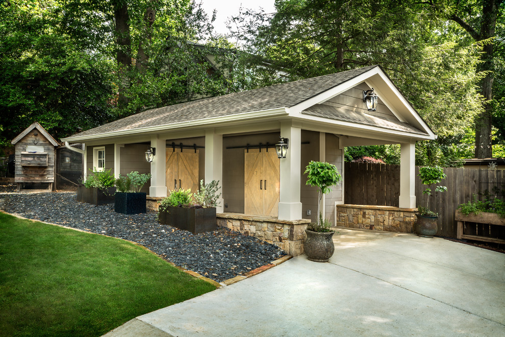 This is an example of a mid-sized traditional detached garage in Atlanta.