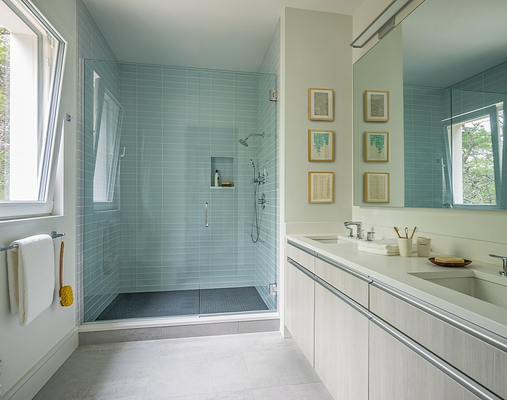 Inspiration for a mid-sized modern master bathroom in Boston with flat-panel cabinets, light wood cabinets, an open shower, green tile, glass tile, white walls, porcelain floors, an undermount sink, engineered quartz benchtops, white floor and a hinged shower door.