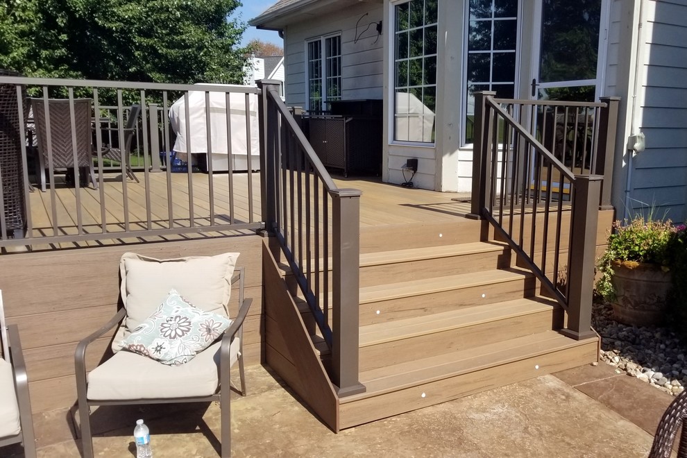 Inspiration for a large backyard deck remodel with no cover