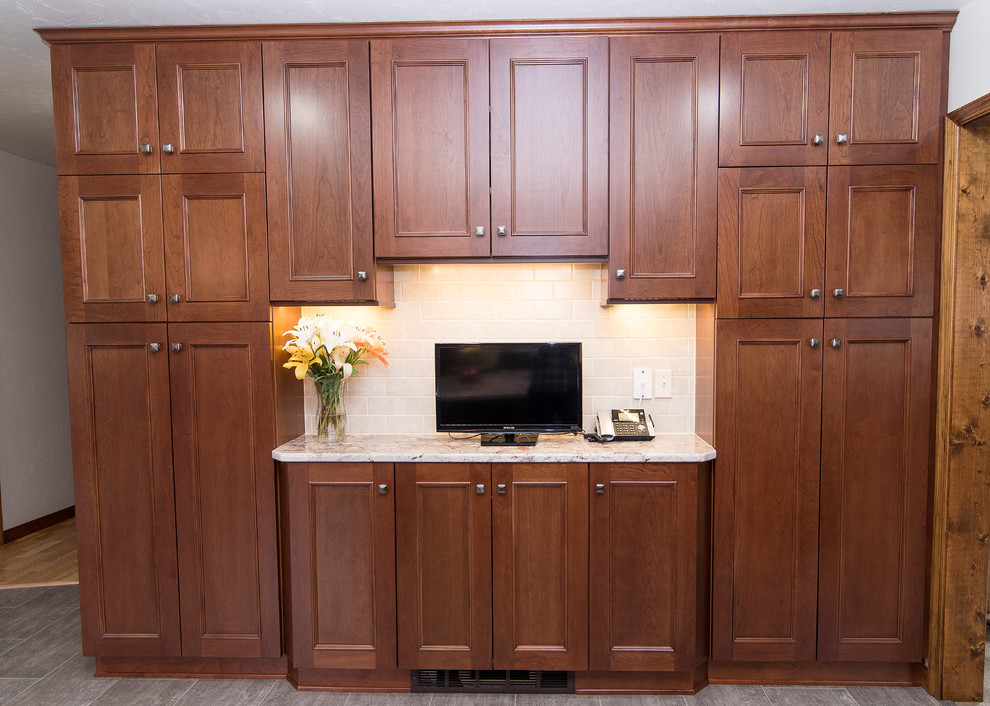 Large elegant l-shaped vinyl floor and beige floor eat-in kitchen photo in Baltimore with an undermount sink, shaker cabinets, medium tone wood cabinets, granite countertops, beige backsplash, ceramic backsplash, stainless steel appliances, an island and white countertops