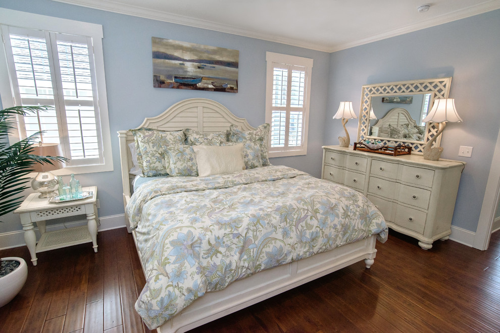 Inspiration for a mid-sized beach style master bedroom in Other with blue walls and dark hardwood floors.