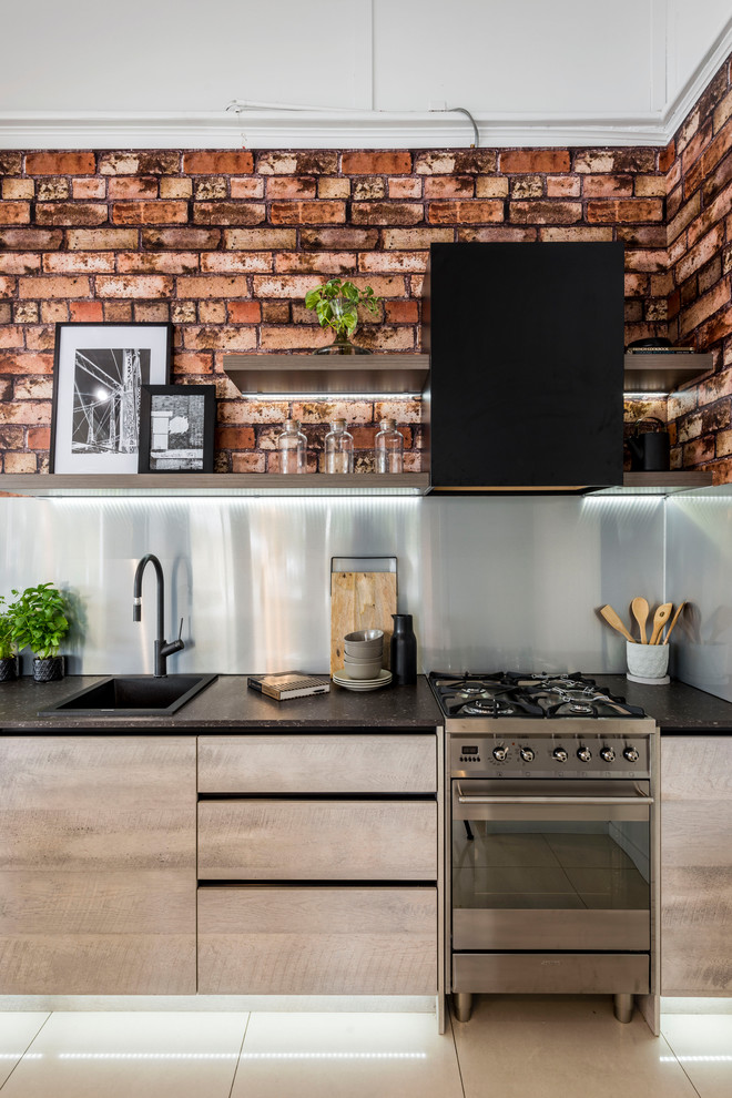 Design ideas for a small industrial single-wall kitchen in Brisbane with a drop-in sink, flat-panel cabinets, grey cabinets, quartz benchtops, grey splashback, stainless steel appliances and no island.