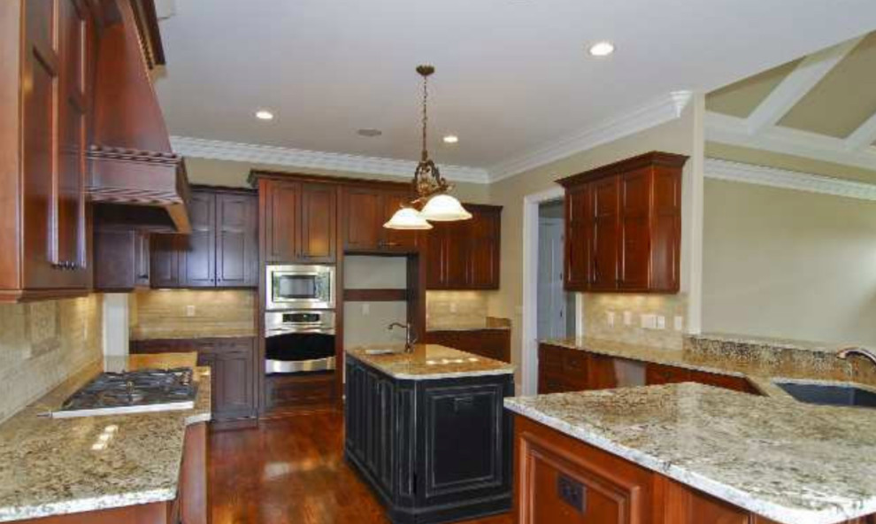 Inspiration for a mid-sized transitional l-shaped medium tone wood floor and white floor open concept kitchen remodel with raised-panel cabinets, white cabinets, quartzite countertops, white backsplash, ceramic backsplash, two islands and beige countertops