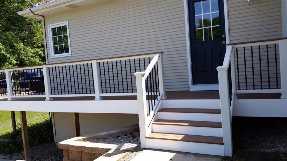 This is an example of a large contemporary backyard deck in Grand Rapids.