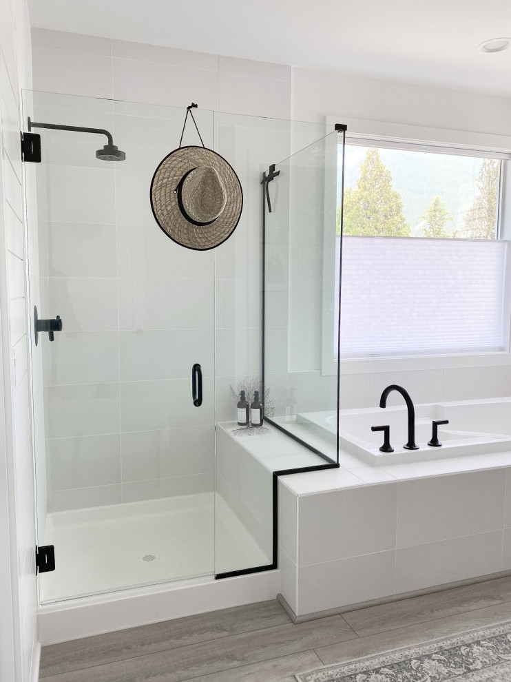 Photo of a mid-sized beach style master bathroom in Seattle with shaker cabinets, grey cabinets, white tile, laminate floors, engineered quartz benchtops, grey floor, white benchtops, a shower seat, a double vanity, a built-in vanity and planked wall panelling.