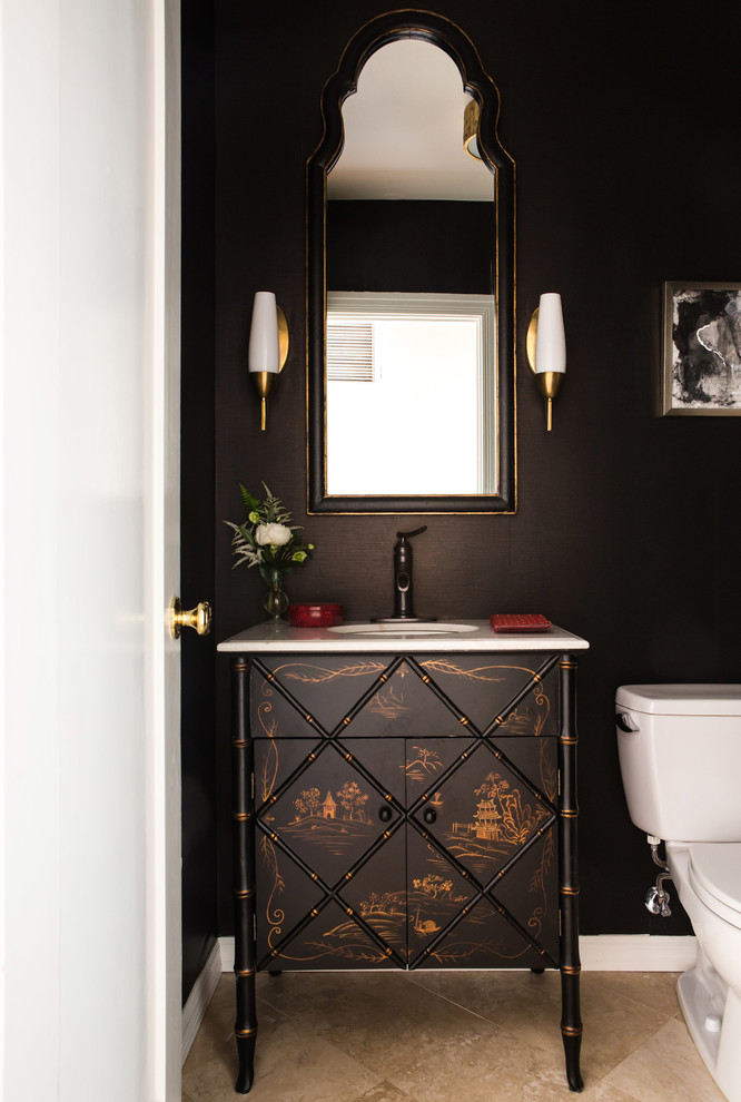 Photo of a traditional powder room in Los Angeles with furniture-like cabinets, black walls and white benchtops.