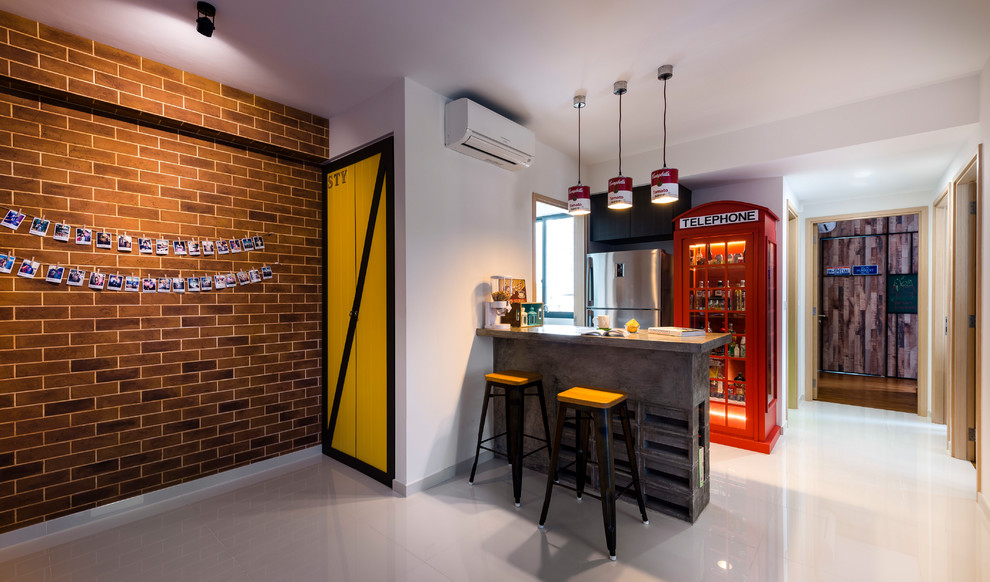 This is an example of an eclectic seated home bar in Singapore with glass-front cabinets, red cabinets, white floor and grey benchtop.