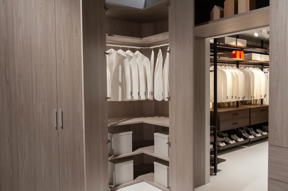 Large contemporary storage and wardrobe in Bremen with painted wood floors and beige floor.