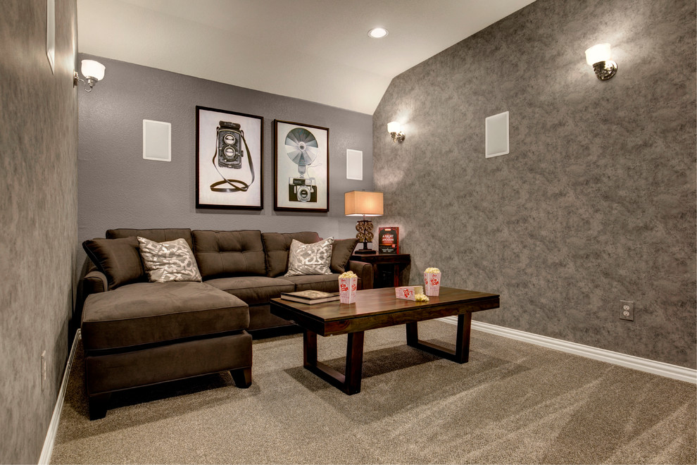 Photo of a mid-sized transitional enclosed home theatre in Dallas with grey walls, carpet, a wall-mounted tv and beige floor.